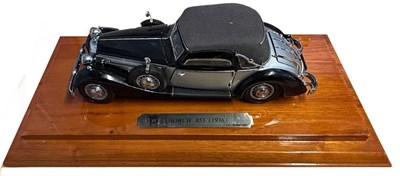 Lot 155 - A pair of cased die-cast scale model cars, to...