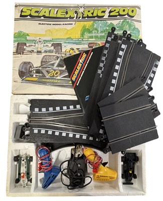 Lot 313 - A vintage Scalextric 200 electronic racing set...