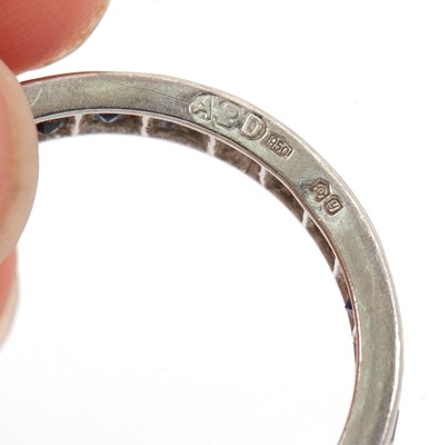 Lot 93 - A platinum sapphire and diamond eternity ring,...