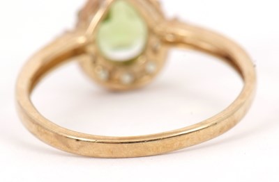 Lot 84 - A 9ct peridot and diamond ring, the pear shape...