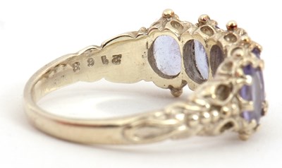 Lot 90 - A 9ct tanzanite ring, with five oval...
