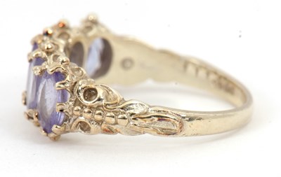 Lot 90 - A 9ct tanzanite ring, with five oval...