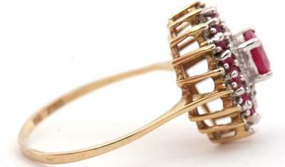 Lot 58 - A 9ct ruby and diamond cluster ring, with...