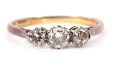 Lot 22 - A three stone diamond ring, with three...