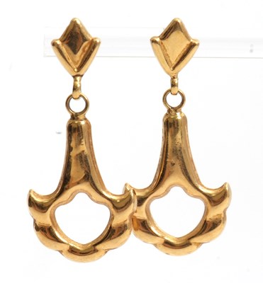 Lot 149 - A pair of 18ct earrings, the shaped and...