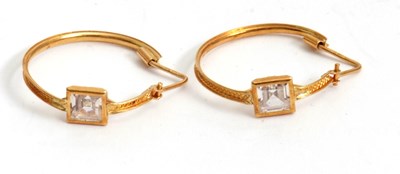 Lot 146 - A pair of 18ct and white stone earhoops, the...