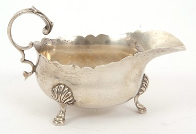 Lot 35 - A George V silver sauce boat of typical form,...