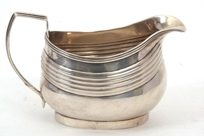Lot 62 - A George III silver cream/milk jug of...