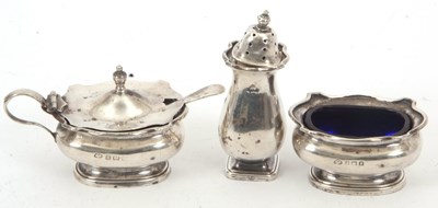 Lot 95 - A George V three piece silver condiment set,...