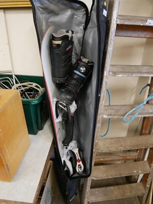 Lot 733 - A snowboard and boots, with case