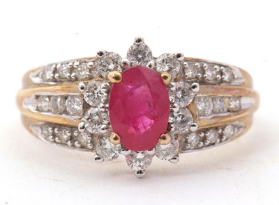 Lot 2 - A 9ct ruby and diamond ring, the central oval...