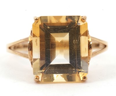 Lot 4 - A 9ct citrine and diamond ring, the emerald...