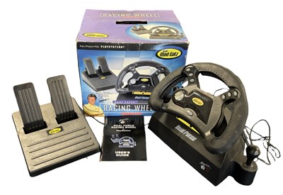 Lot 309 - A boxed  Mad Catz racing wheel and pedals for...