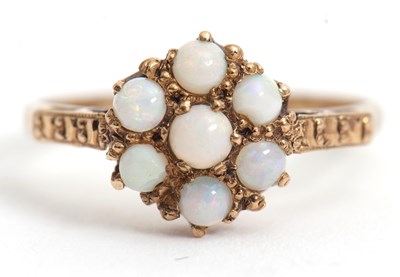 Lot 74 - An opal cluster ring, set with round opal...