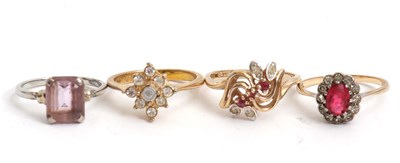 Lot 218 - Four mixed rings: to include a pale amethyst...