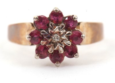 Lot 18 - A 9ct ruby cluster ring, with small illusion...