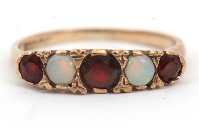 Lot 17 - A opal and garnet ring, with alternating round...