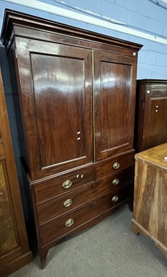 Lot 464 - A Georgian mahogany linen press with a moulded...