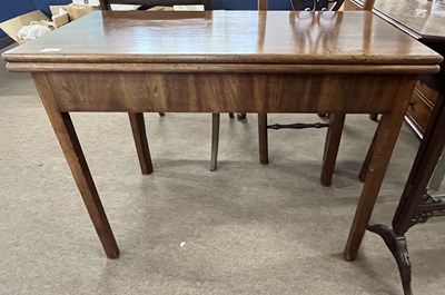 Lot 479 - A Georgian mahogany tea table of plain...