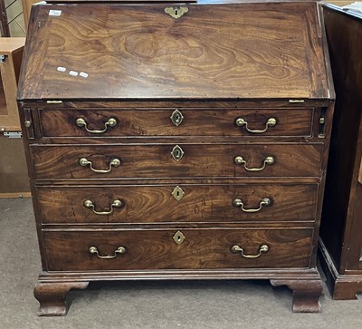 Lot 512 - A George III mahogany bureau, the full front...
