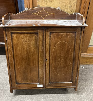 Lot 517 - An Edwardian mahogany two door wall cabinet,...