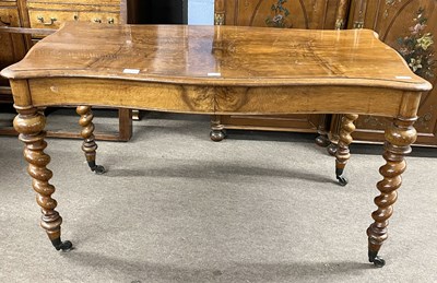 Lot 538 - A Victorian walnut centre table of serpentine...