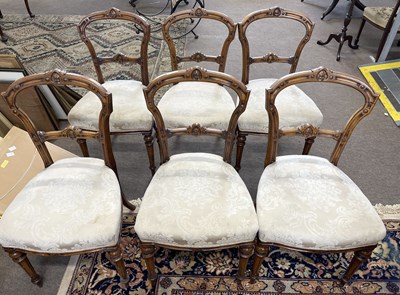 Lot 561 - A set of six late 19th Century walnut dining...
