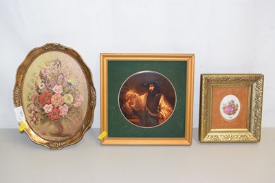 Lot 137 - Two framed decorative ceramic plaques together...