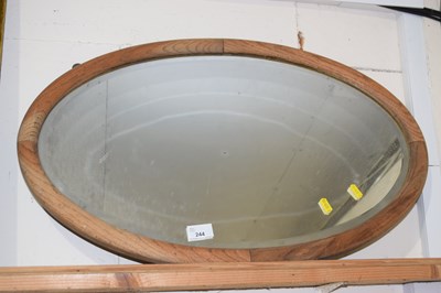 Lot 244 - Oval wooden framed over mantel mirror