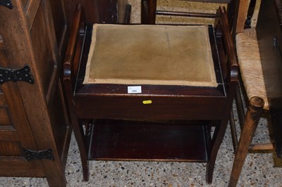 Lot 305 - A small lift top piano stool