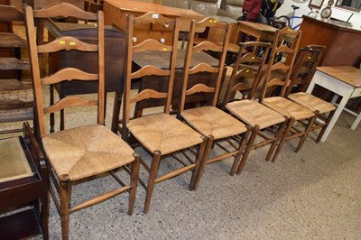Lot 307 - Set of four rush seat ladder back chairs...