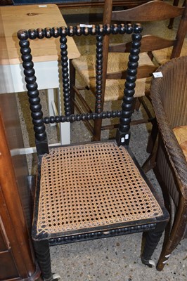 Lot 316 - Cane seated bedroom chair with bobbin turned...