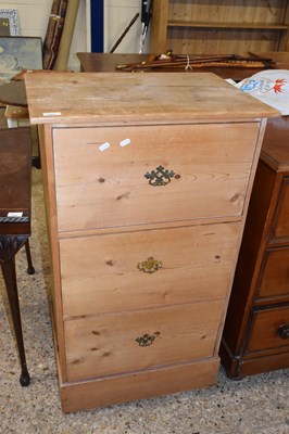 Lot 324 - A waxed pine tall chest of three drawers,...