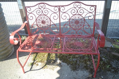 Lot 122 - An ornate decorative metal two seater garden...