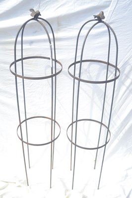 Lot 134 - A pair of small metal bird topped plant stands,...