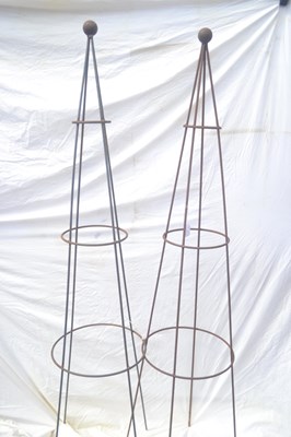 Lot 135 - A pair of ball topped metal garden obelisks,...