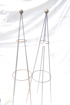 Lot 136 - A pair of ball topped metal garden obelisks,...