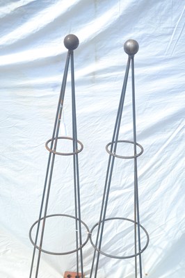 Lot 138 - A pair of ball topped metal garden obelisks,...