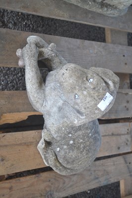 Lot 162 - A figure of a recumbent dog, length approx 42cm