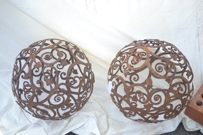 Lot 164 - A pair of ornate metal decorative garden balls,...