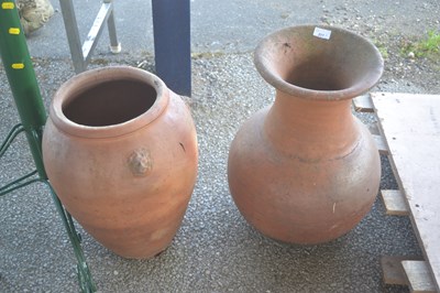 Lot 217 - Two various terracotta urns, the larger height...