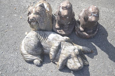 Lot 242 - Four various composition dog figures