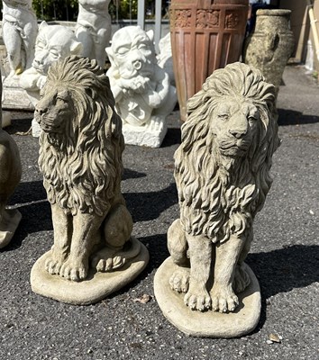 Lot 101 - Pair of composition figures of crouching Lions