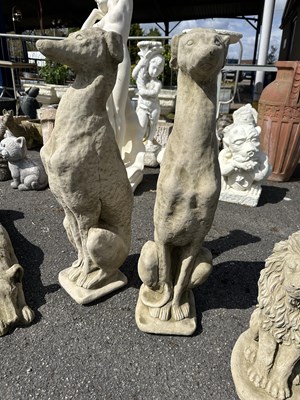 Lot 102 - Pair of large figures of seated Whippets