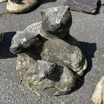 Lot 108 - Small moulded figure depicting three Otters (?)