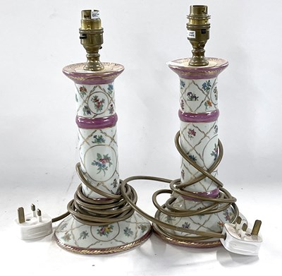 Lot 307 - A pair of porcelain candlesticks, 25cm hight