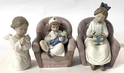 Lot 317 - A Nao figure of a young girl in nurses uniform...