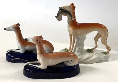 Lot 340 - A pair of Staffordshire pen holders modelled...