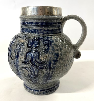 Lot 351 - A German Rhenish stone ware jug with silver rim