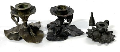 Lot 382 - Group of three chamber sticks on leafy bases,...